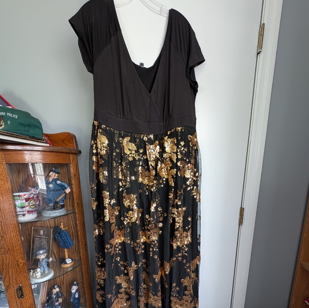 Plus size woman black and gold dress